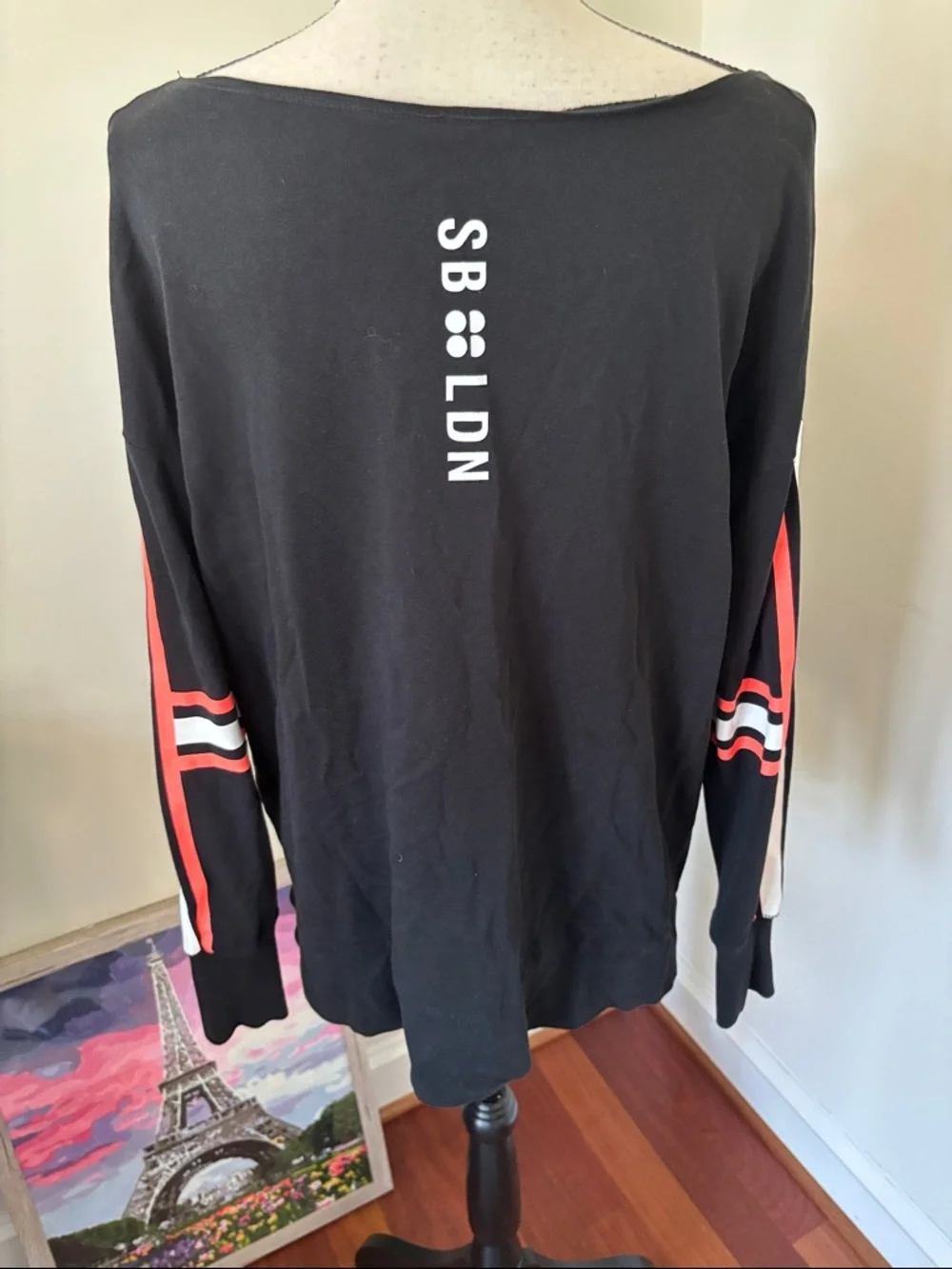 Sweaty Betty Black Long-Sleeve Top with Orange and White Sleeve Stripes - Picture 4 of 4